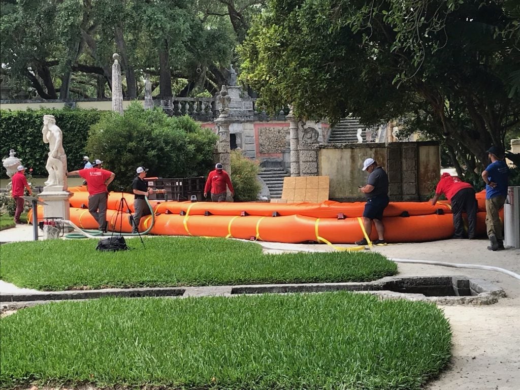 An orange "Tiger Dam" at the Vizcaya Museum and Gardens in Miami can fill up with water in case of flooding.