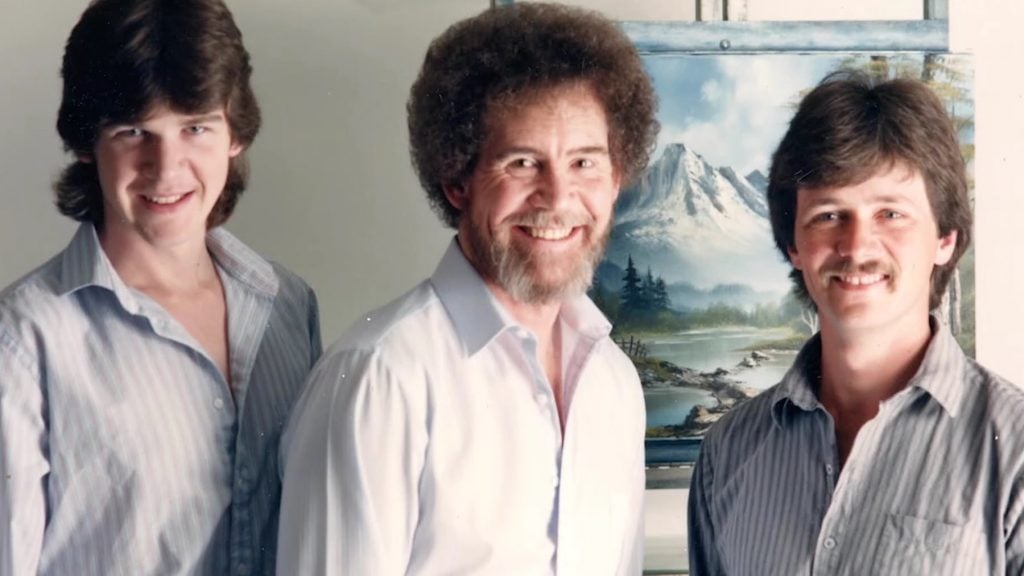 Left to Right: Steve Ross, Bob Ross, and Dana Jester in <em>Bob Ross: Happy Accidents, Betrayal & Greed</em>. Courtesy of Netflix © 2021.