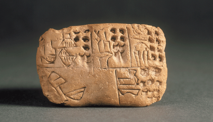 Tablet with Proto-cuneiform Inscription, Late Uruk (ca. 3,400–3,100 B.C.) unfired clay. Musée du Louvre, Department of Near Eastern Antiquities, Paris. Photo by Franck Raux, ©RMN-Grand Palais/Art Resource, New York.
