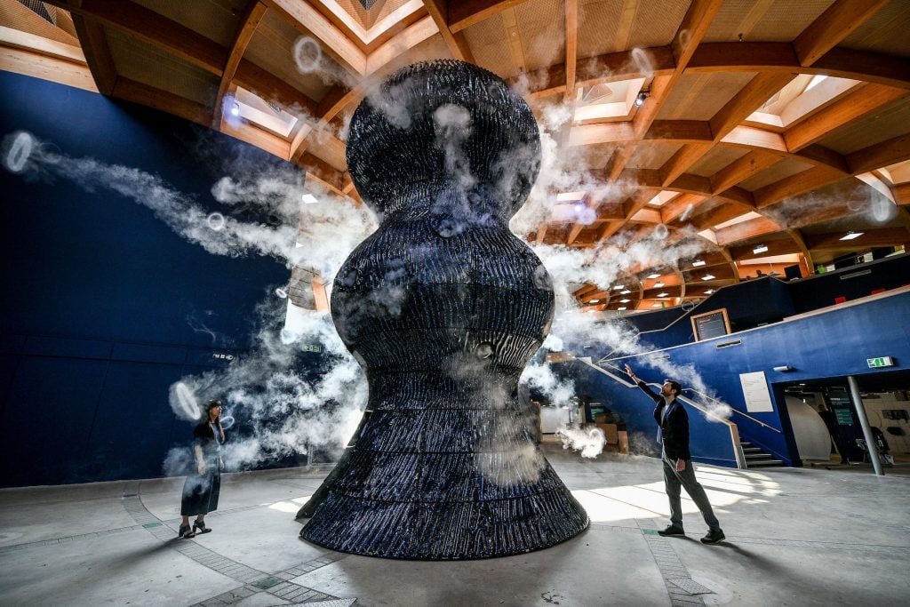 Smoke rings emerge from a sculpture by Studio Swine as it is unveiled at the Eden Project in Bodelva, Cornwall. (Photo by Ben Birchall/PA Images via Getty Images)