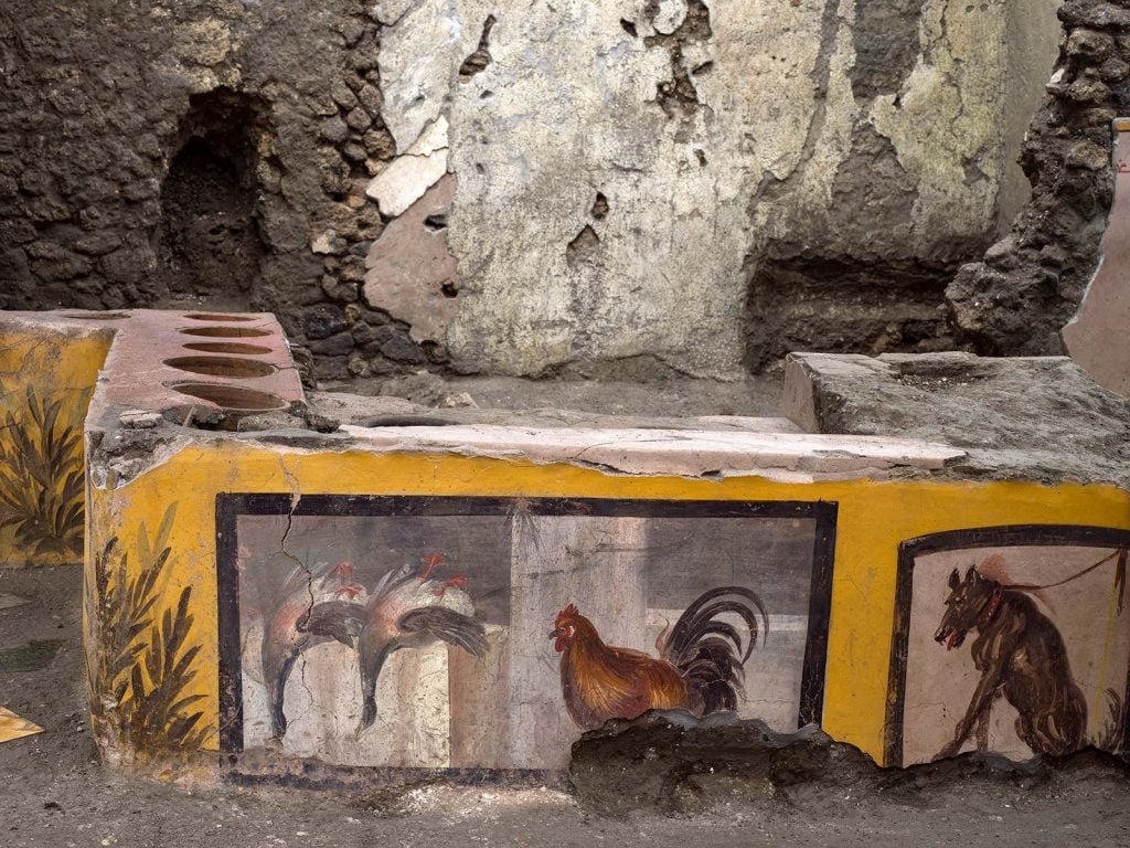 The <em>thermopolium</em>, or fast food restaurant, from Regio V in Pompeii.  Photo by Luigi Spina, courtesy of the Pompeii Archaeological Park “width =” 1024 “height =” 768 “srcset =” https://news.artnet.com/app/news-upload/2021/08/vpuhw2uiygvulue64vme-1024×768 .jpeg 1024w, https://news.artnet.com/app/news-upload/2021/08/vpuhw2uiygvulue64vme-300×225.jpeg 300w, https://news.artnet.com/app/news-upload/2021/08 / vpuhw2uiygvulue64vme -50×38.jpeg 50w, https://news.artnet.com/app/news-upload/2021/08/vpuhw2uiygvulue64vme.jpeg 1600w “size =” (max-width: 1024px) 100vw, 1024px “/></p>
<p class=