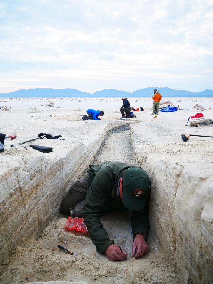 Researchers excavating prehistoric footprints in the bottom of a trench at White Sands National Park, New Mexico. Photo by Dan Odess, courtesy of the National Park Service. 