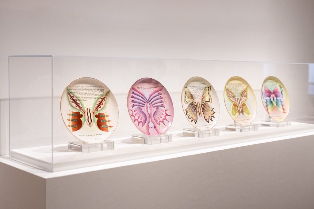 Judy Chicago, <eM>The Dinner Party</em> test plates in her retrospective at the de Young Museum, San Francisco. Photo by Gary Sexon, courtesy the de Young Museum, San Francisco.