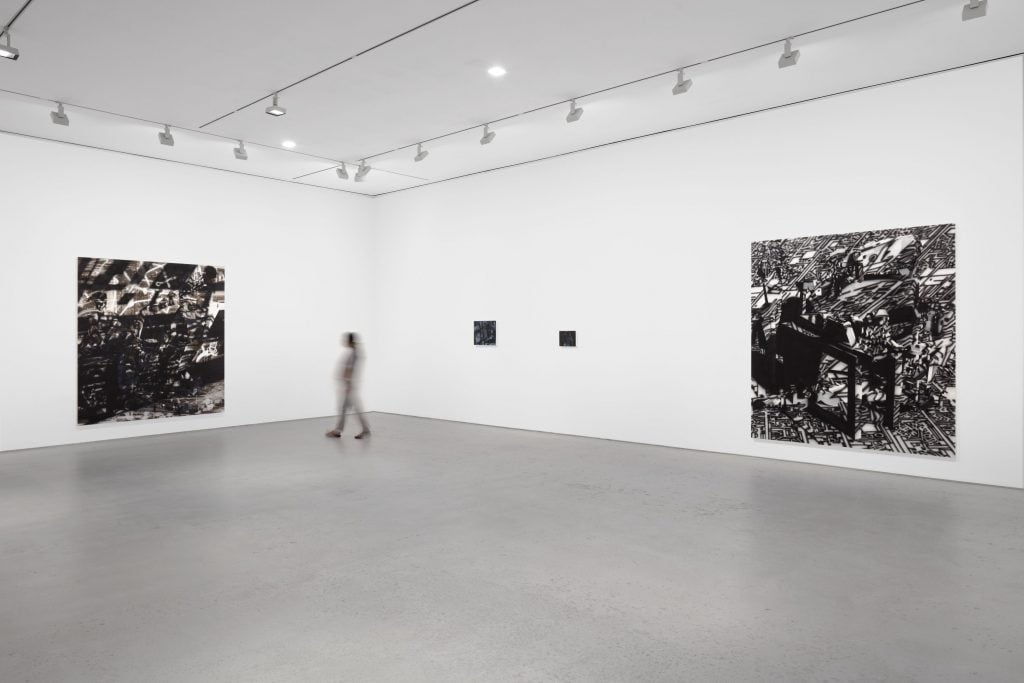Installation view "Avery Singer. Reality Ender" at Hauser & Wirth, New York. Picturing: <i>Studio</i> (2019); <i>Sculptor</i> (2021); and <i>Wojack Battle Scene</i> (2021). © Avery Singer, courtesy the artist, Hauser & Wirth, and Kraupa-Tuskany Zeidler, Berlin. Photo: Lance Brewer.