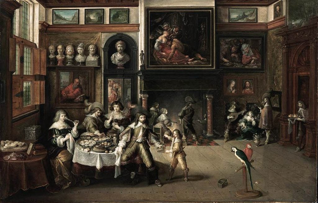 Frans Francken the Younger, <em>Supper at the House of Burgomaster Rockox</em> (ca. 1630–1635). The painting shows Peter Paul Rubens's <em>Samson and Delilah</em>. Because Francken included Samson's full foot, some people believe that the National Gallery in London's painting of the same name, which crops out his toes, must be a copy. Collection of the Alte Pinakothek, Munich, Germany.