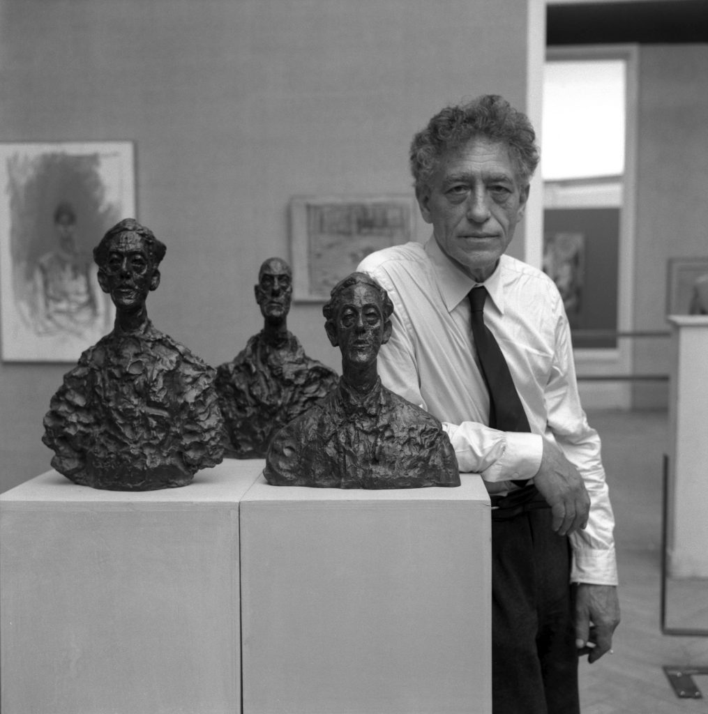Alberto Giacometti presents three of his bust sculptures at the 31st Art Biennale Exposition in Venice, 1962. Photograph by Archivio Cameraphoto Epoche/Getty Images.