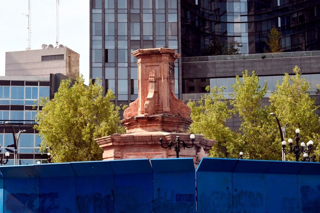 View of an empty pedestal after the statue of Italian navigator Christopher Columbus was removed at Reforma Avenue, in Mexico City on October 11, 2020. Photo: Alfredo Esrella/AFP via Getty Images.