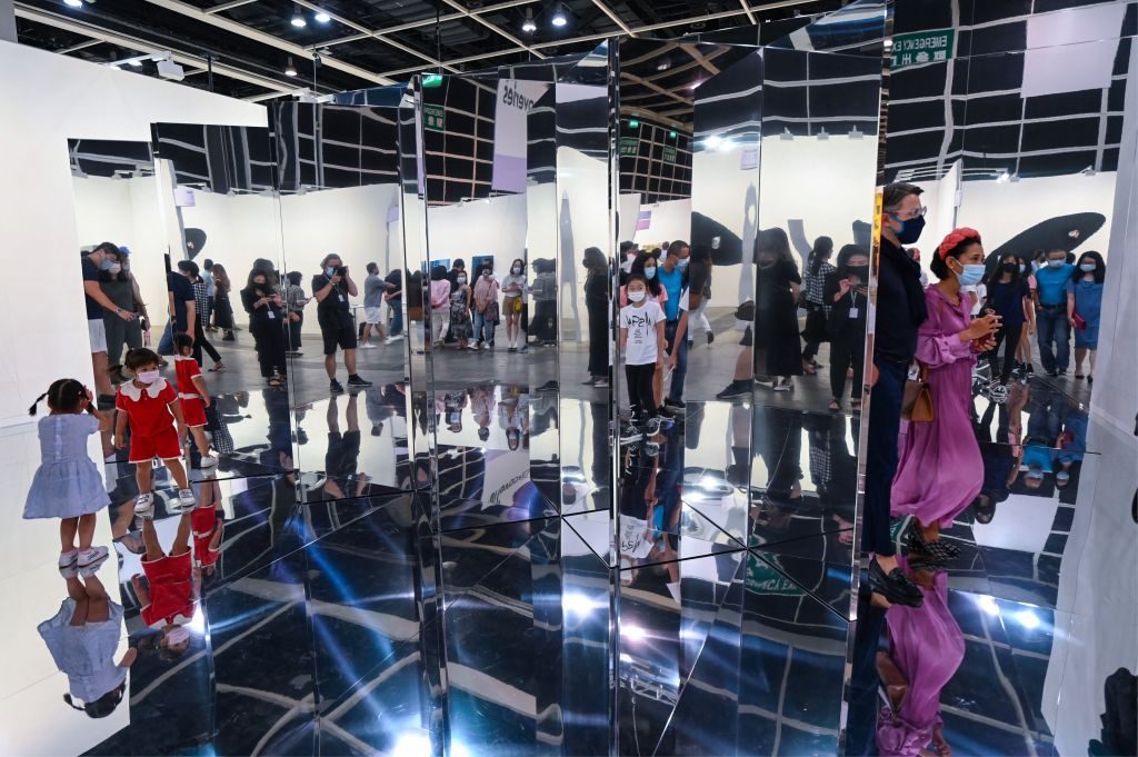 Visitors attend the first preview day of Art Basel at the convention and exhibition center in Hong Kong on May 19, 2021. (Photo by PETER PARKS/AFP via Getty Images)
