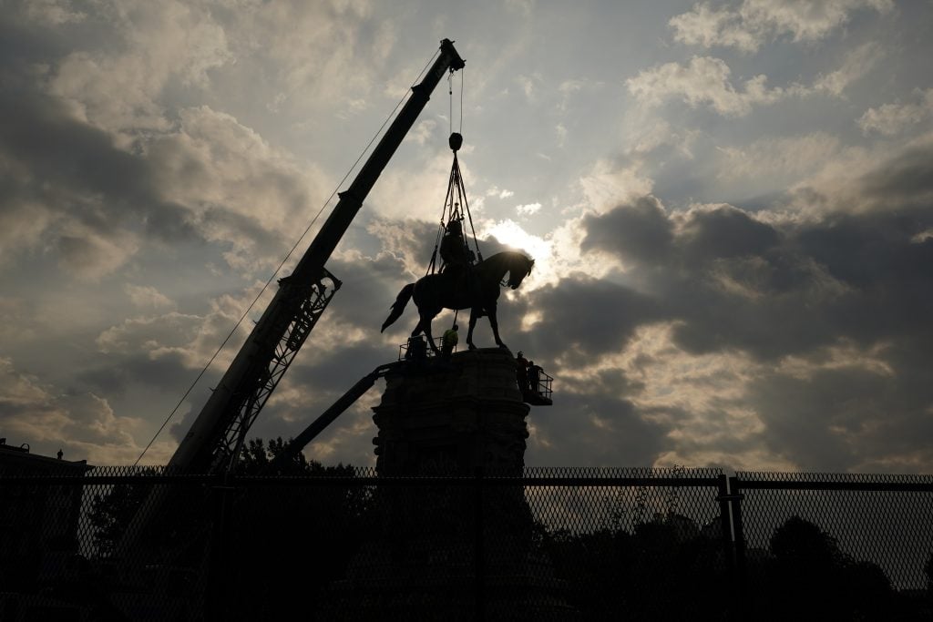 Crews prepare to remove one of the country's largest remaining monuments to the Confederacy, a towering statue of Confederate General Robert E. Lee on Monument Avenue, September 8, 2021 in Richmond, Virginia. Photo by Steve Helber - Pool/Getty Images.
