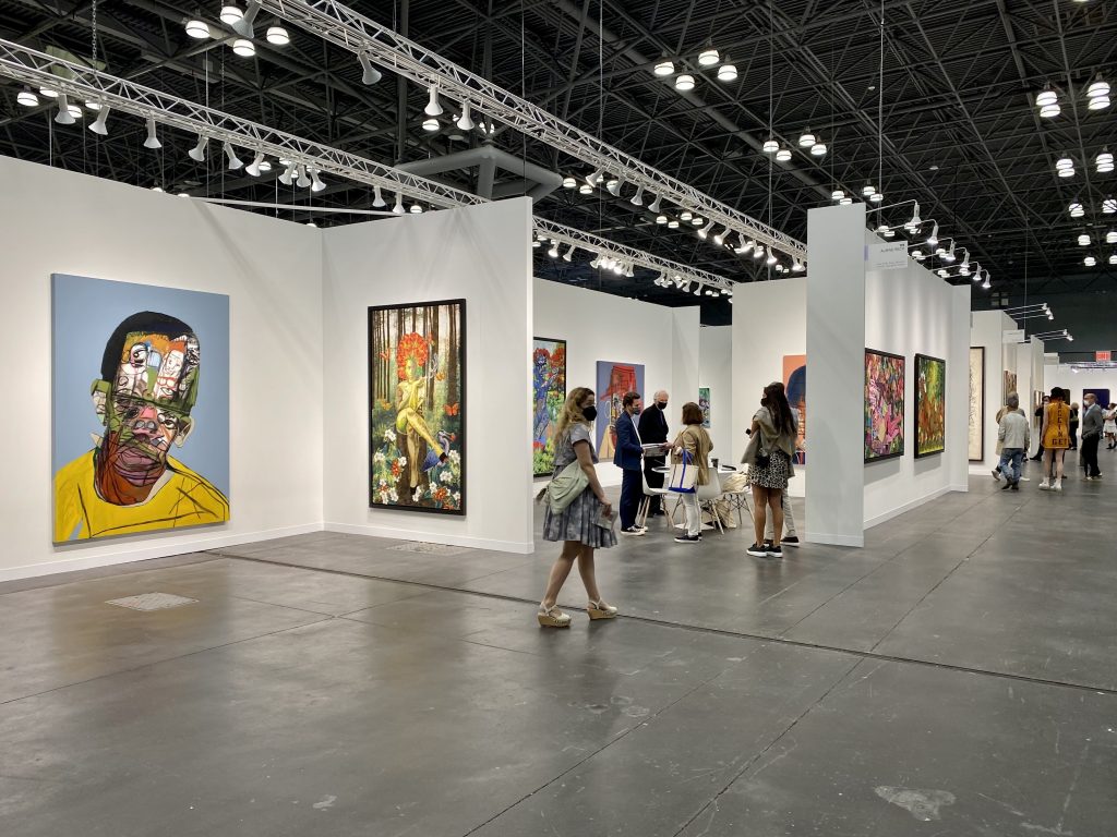 Paintings by Genesis Tramaine and quilted works Phyllis Stephen’s at Almine Reche, New York, at the 2021 Armory Show at the Javits Center in New York. Photo by Sarah Cascone.