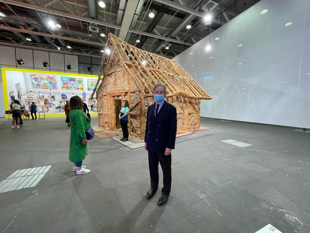Jeffrey Deitch at the fair with Urs Fischer's Untitled (Bread House) (2004-2006). Photo: Kate Brown