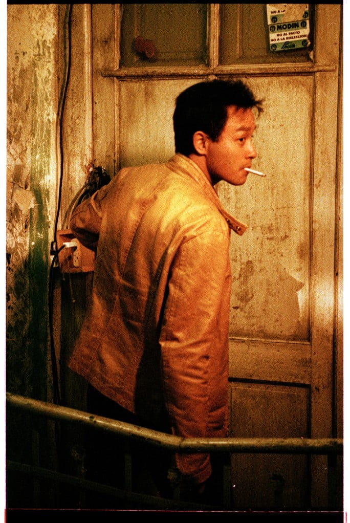 Sotheby's will auction the yellow leather jacket worn by leading actor Leslie Cheung in from director Wong Kar Wai's <em>Happy Together</em> (1997). Photo by Wing Shya, ©️Jet Tone Film, courtesy of Sotheby's. 