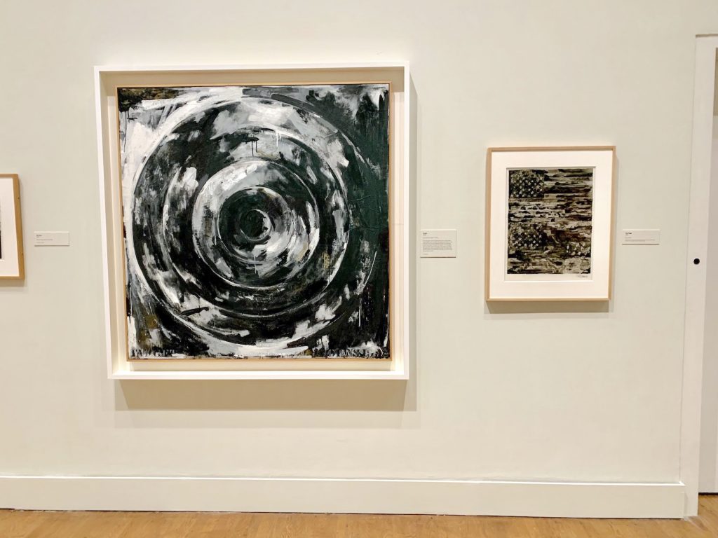 Jasper Johns, <em>Target</em> (1992) and <em>Two Flags</em> (1985) in the "Nightmares" gallery of "Jasper Johns: Mind/Mirror" at the Philadelphia Museum. Photo by Ben Davis.