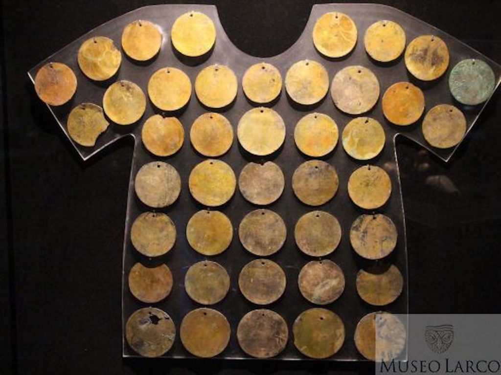 Set of forty-two circular metal discs of gilded silver, shown in hypothetical use on a shirt (ca. 1250 BC–1 AD). Collection of the Museo Larco, Lima, Peru. Photo courtesy of World Heritage Exhibitions.