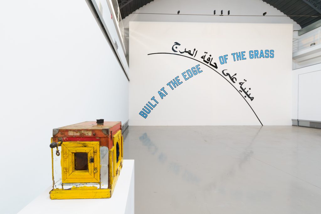 Lida Abdul's Time, Love and the Workings of Anti-Love, (2013) and Lawrence Weiner's Built at the edge of the grass, (2007)Courtesy the artist; Galleria Giorgio Persano, Torino; Fondazione Merz.