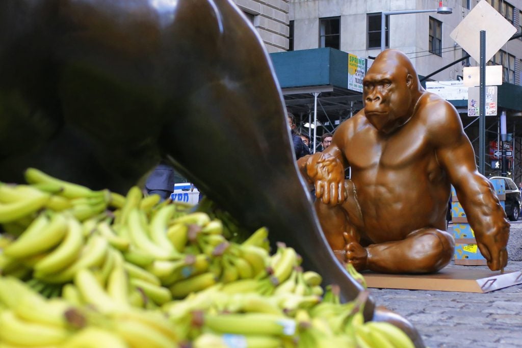 A Harambe statue is seen in front of the <em>Charging Bull</em> statue on October 18, 2021 in New York City. Photo by Michael M. Santiago/Getty Images.