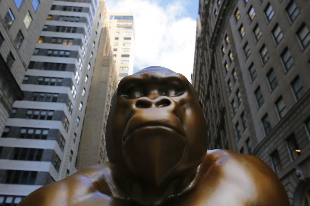 A statue of Harambe is seen on October 18, 2021 in New York City. The Sapien.Network, a social networking platform currently under development, unveiled a seven-foot statue of Harambe, a gorilla from the Cincinnati Zoo and Botanical Garden who became a media sensation in May 2016 who was shot by zookeepers to protect a child, in front of the Charging Bull statue that was surrounded by bananas to protest wealth disparity in the country. Photo by Michael M. Santiago/Getty Images.