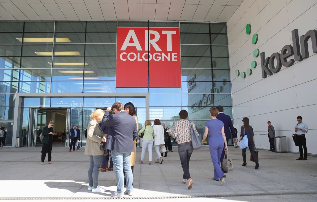 Visitors arrive at the Art Cologne exhibition preview at Koelnmesse in Cologne, Germany. Photo: Andreas Rentz/Getty Images.