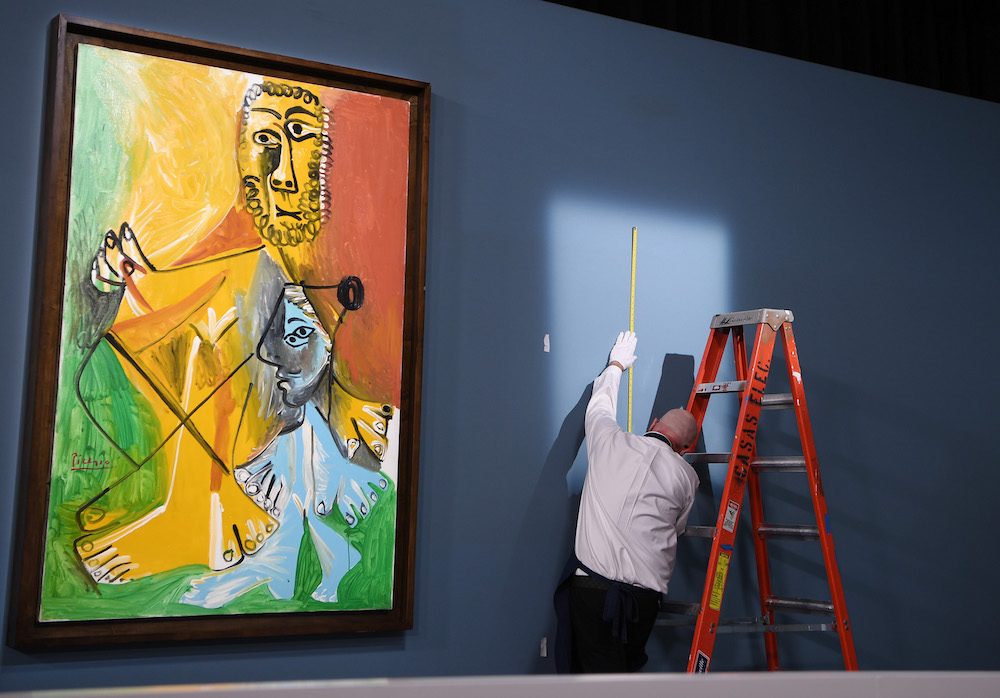 Art handlers at Sotheby's. Photo by Denise Truscello/Getty Images for Sotheby's)