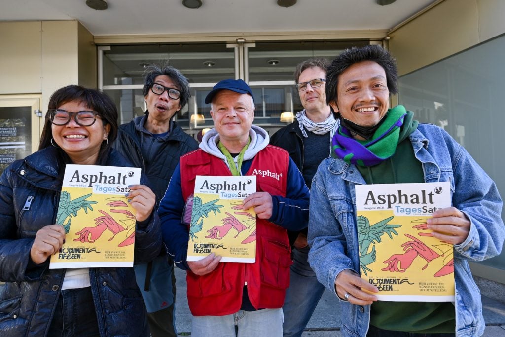 Iswanto Hartono (both from the artist collective ruangrupa), Stefan Marx (seller of the street newspaper Asphalt”), Volker Macke (editorial director of Asphalt”), and Reza Afisina (ruangrupa) present the October issue of Asphalt” with the complete artist list of the exhibiting artists of 