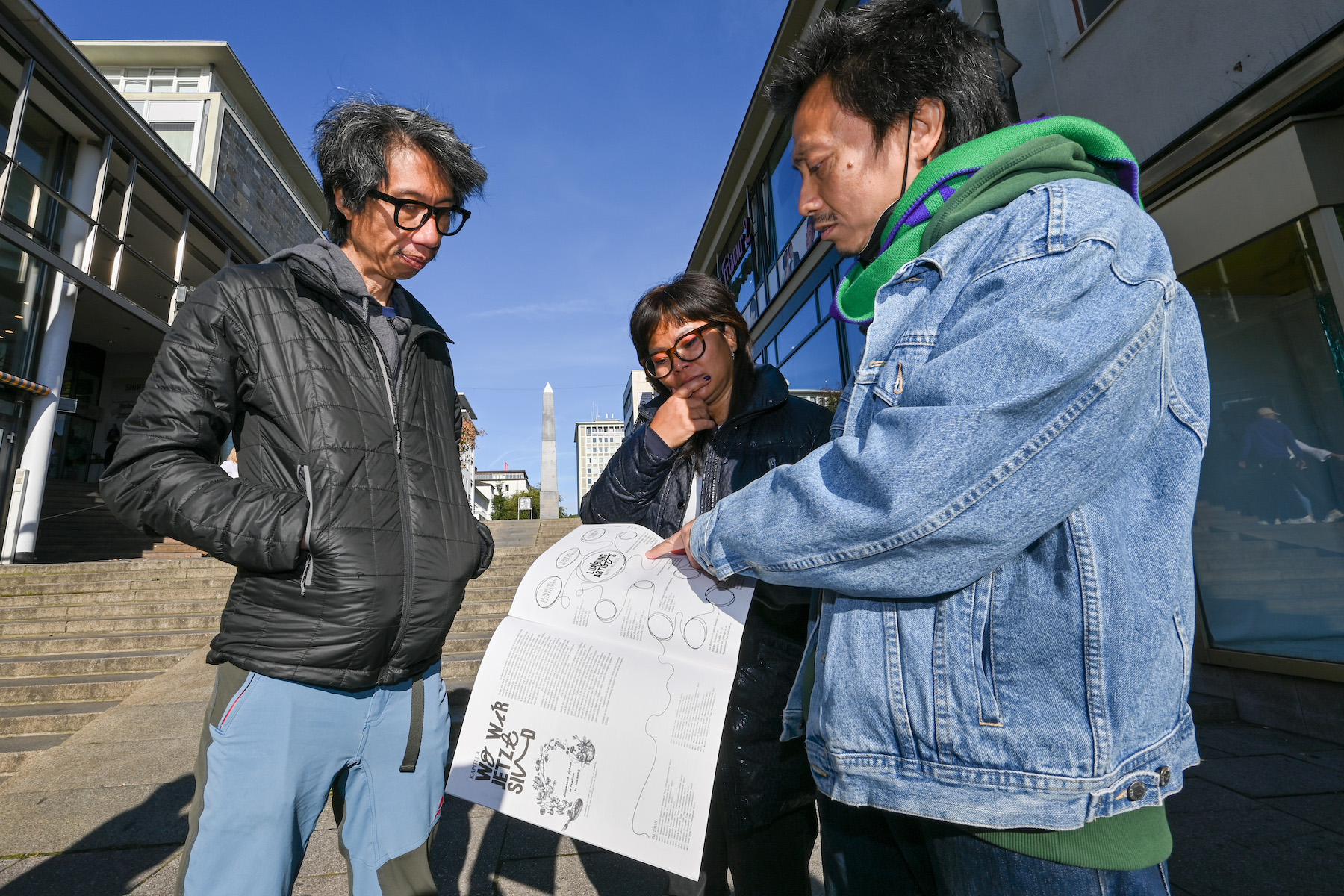 Left to right: Iswanto Hartono, Daniella Fitriap and Reza Afisina from the artist collective ruangrupa in front of the ruruHaus in the October issue of Asphalt with the complete artist list of the exhibiting artists of documenta. (Photo by Uwe Zucchi/picture alliance via Getty Images)