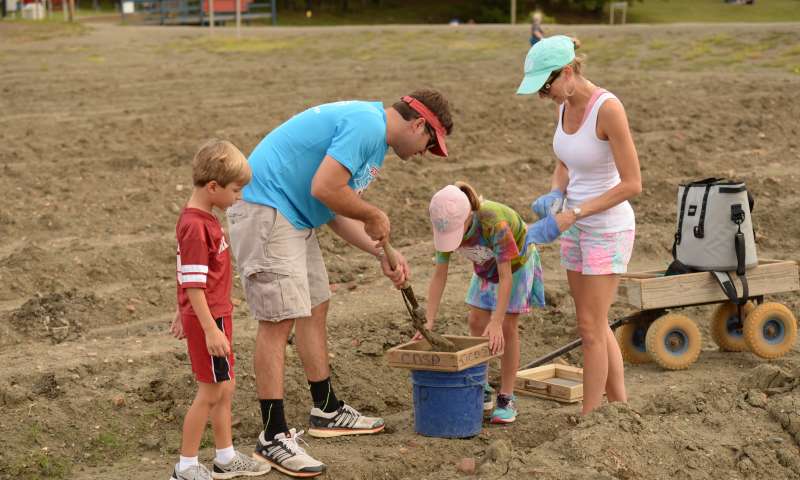 A family digging for diamonds at Crater of Diamonds State Park in Murfreesboro, Arkansas. Photo courtesy of Arkansas State Parks.