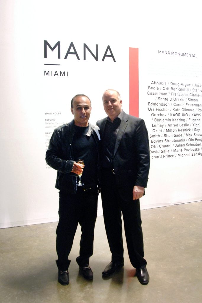 Moishe Mana [L] and Eugene Lemay [R] at Mana Contemporary Gallerist's Party, December 2014. © Patrick McMullan. Photo: Erik Puotinen/patrickmcmullan.com.