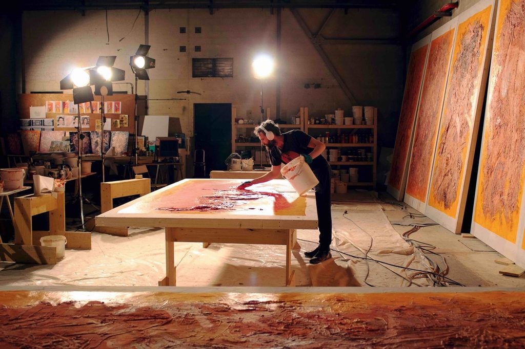 Sandro Kopp making paintings for The French Dispatch. Photo by Caris Yeoman.