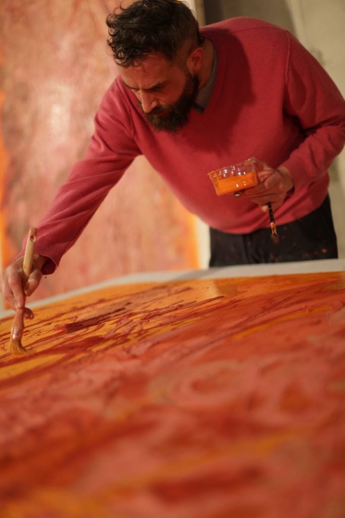 Sandro Kopp making paintings for The French Dispatch. Photo by Sian Smith.