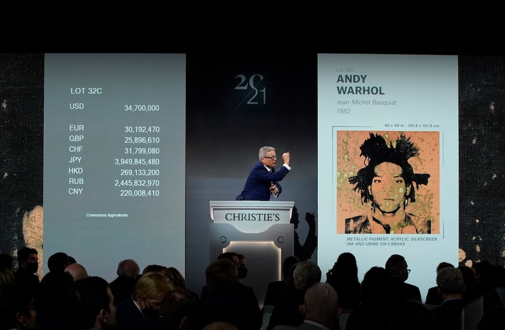 Jussi Pylkkanen selling Andy Warhol's portrait of Jean-Michel Basquiat (1982) at Christie's in November 2021. Image courtesy Christie's.
