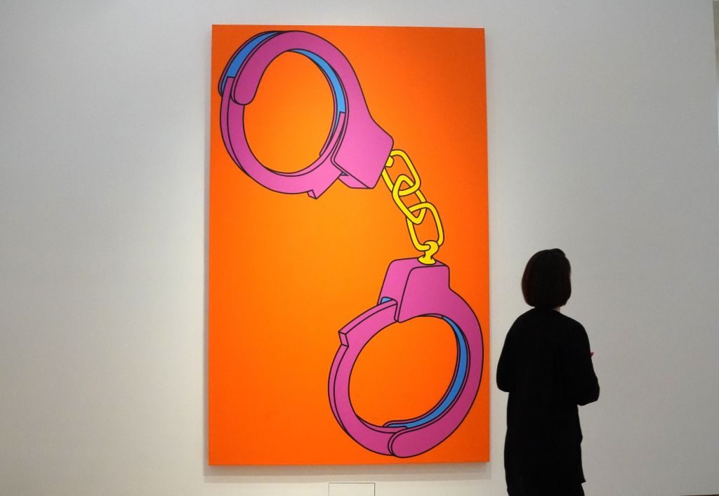 Michael Craig-Martin, Handcuffs on view at Christie's New York in 2019. Photo by Timothy A. Clary/AFP via Getty Images.