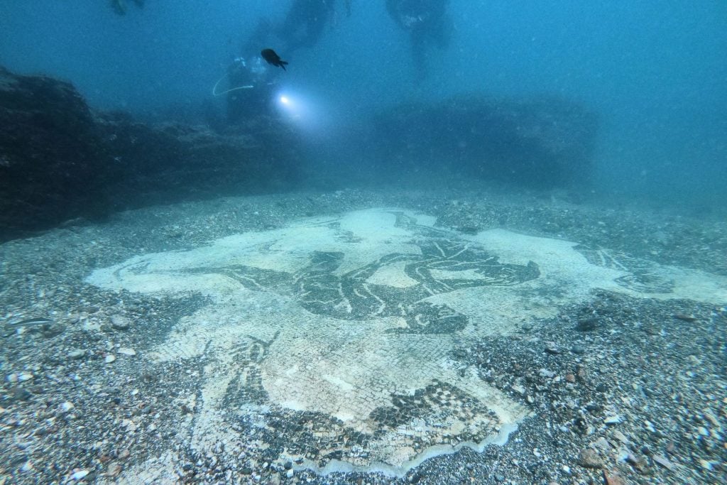 A mosaic from Villa a Protiro in the submerged ancient Roman city of Baia at the Underwater Archaeological Park of Baia, part of the Campi Flegrei Archaeological Park complex site in Pozzuoli near Naples. Photo by Andreas Solaro/AFP via Getty Images.