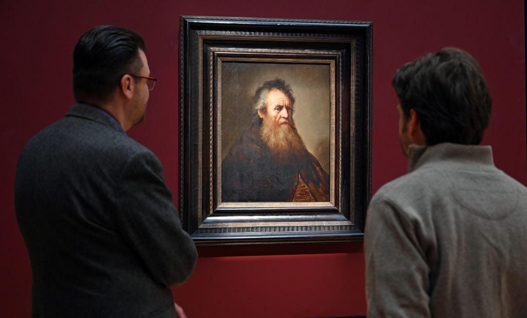 Timo Trümper (r), Curator of the exhibition and Director of Science and Collections, and Marco Karthe (l), Director of Communication and Education at the Friedenstein Palace Foundation, look at the painting Portrait of an Old Man (after 1632) in the special exhibition 