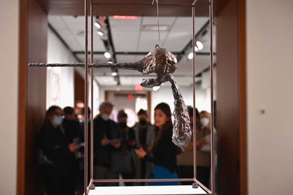 People look at Alberto Giacometti's "Le Nez", part of The Macklowe Collection, at Sotheby's on November 5, 2021 in New York City. (Photo by ANGELA WEISS/AFP via Getty Images)