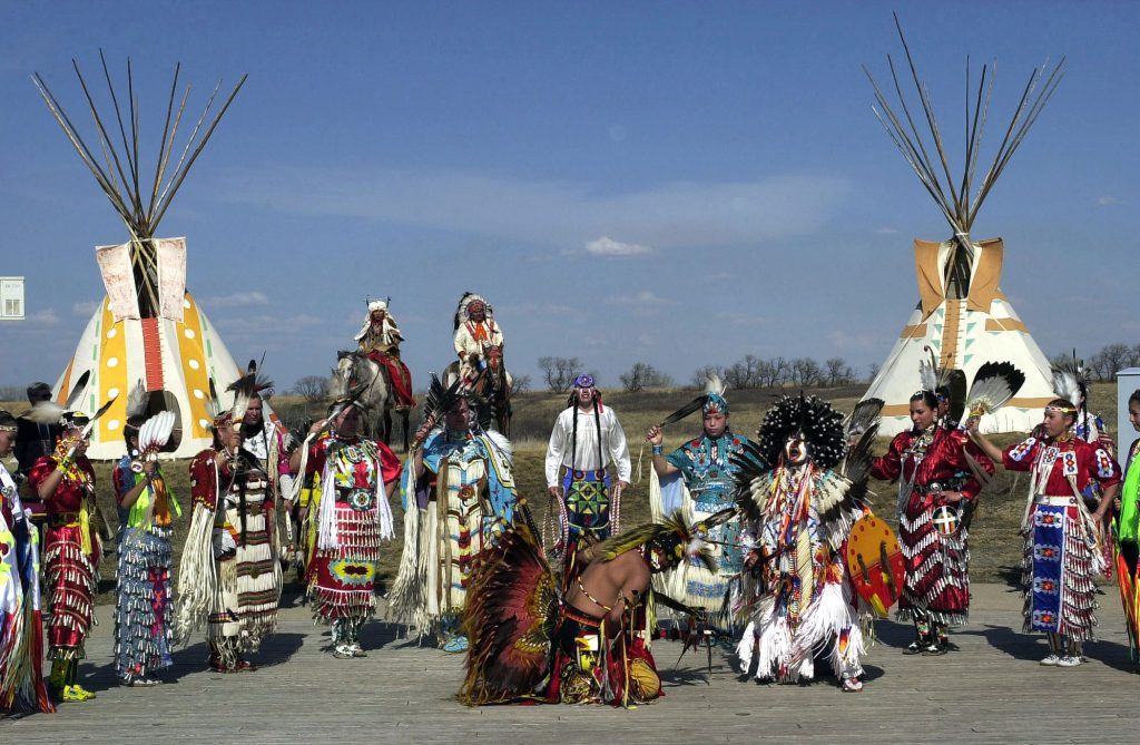 First Nations people in traditional dress at Wanuskewin Heritage Park. Photo by Tim Graham/Sygma/Corbis via Getty Images