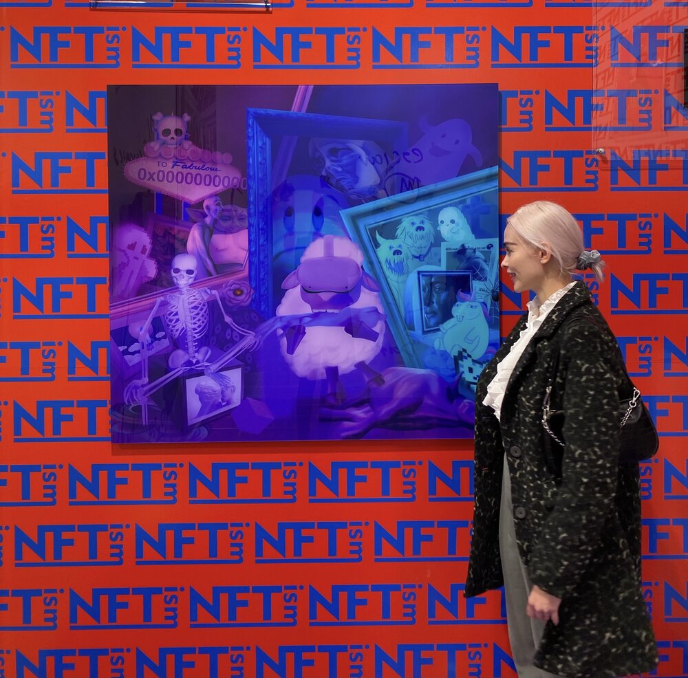 Artist Olive Allen with her NFT work Post-Death or the Null Address (2021) in Galerie Nagel Draxler's booth at Art Basel 2021. Courtesy Olive Allen.