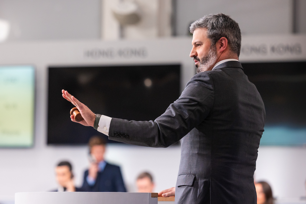 Sotheby’s auctioneer Quig Bruning fielding bids for the Constitution at Sotheby’s New York. Image courtesy Sotheby's.