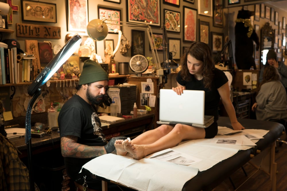 Matt Moreno tattooing the Ötzi tattoos on Nicole Wilson at Three Kings Brooklyn. Photo by TJ Proechel, courtesy of Nicole Wilson.