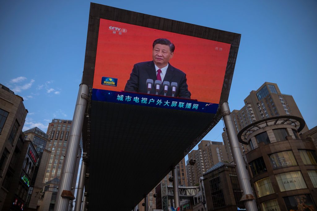 Chinese President Xi Jinping is seen on a big screen showing the Chinese state television CCTV evening news as the city gets ready for the upcoming centenary of the Communist Party of China on June 30, 2021 in Beijing, China. (Photo by Andrea Verdelli/Getty Images)