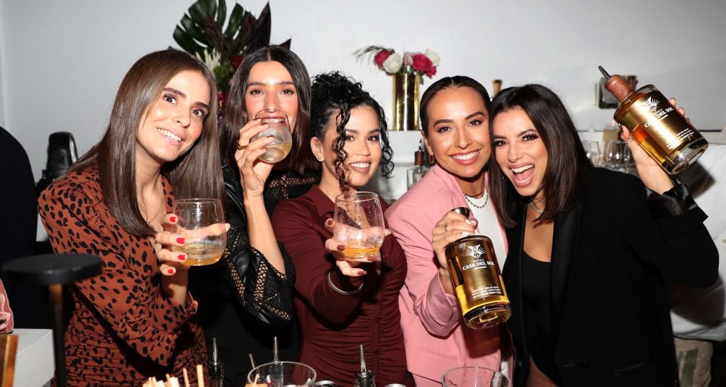 FWIW, we have no reason to believe these specific people have COVID, but we did need something to illustrate this article. Casa Del Sol Tequila held an event at the 1 Hotel South Beach on December 3, 2021 during Miami Art Week. (Photo by Cassidy Sparrow/Getty Images for Casa Del Sol)