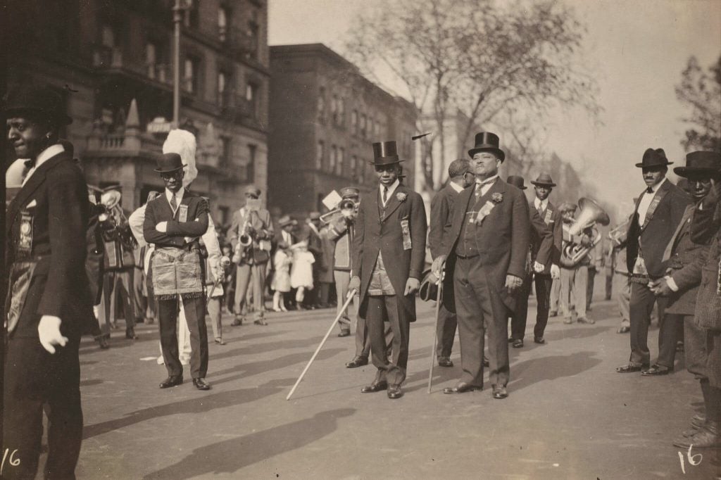 A parade in Harlem photographed by James Van Der Zee in the 1920s. Photo: James Van Der Zee Archive/Metropolitan Museum of Art.
