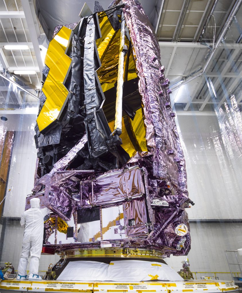 NASA’s James Webb Space Telescope folded up on the Ariane 5 rocket ahead of its launch on, Saturday, Dec. 25, 2021. Photo by Chris Gunn, courtesy of NASA, Creative Commons <a href=https://creativecommons.org/licenses/by-sa/2.0/deed.en target="_blank" rel="noopener">Attribution 2.0 Generic</a> license. 