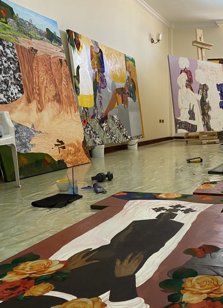 A glimpse inside the artist's studio, where artworks cover every surface. Courtesy of Hana Yilma Godine.