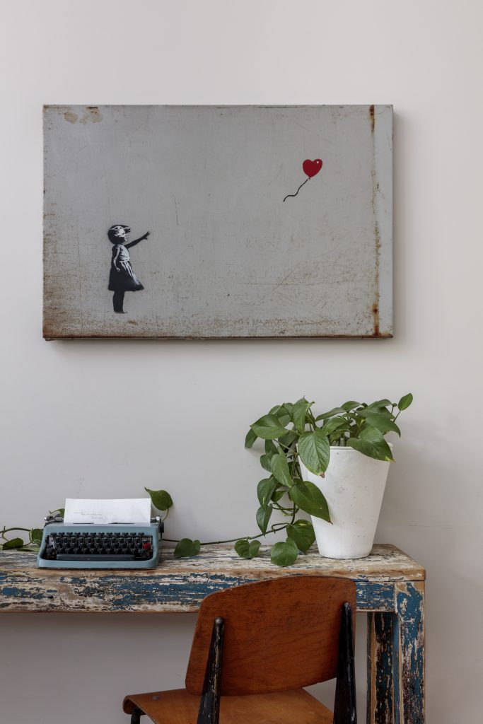 Banksy, <i>Girl with Balloon</i>. Photo taken at Robbie Williams home. Credit Joshua White, courtesy Sotheby's.