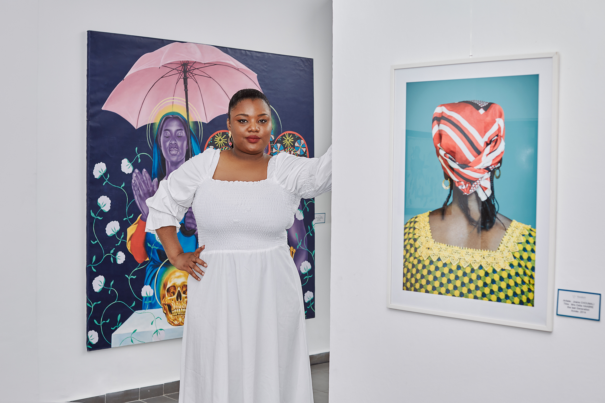 Diane Audrey Ngako with works by Marc Padeu and Joana Choumali.