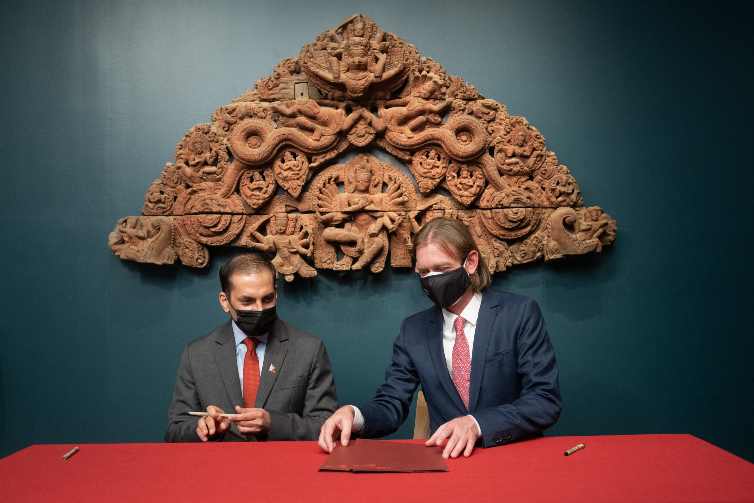 Nepal’s acting consul general, Bishnu Prasad Gautam [L], with Rubin executive director Jorrit Britschgi [R] at the Rubin Museum of Art this week.