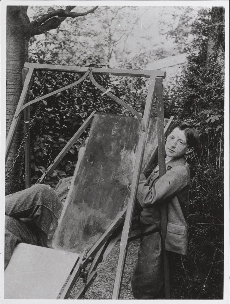 Marcel Duchamp as boy standing beside a wooden swing, circa 1900. From the Alexina and Marcel Duchamp Papers, Philadelphia Museum of Art, Library and Archives. 