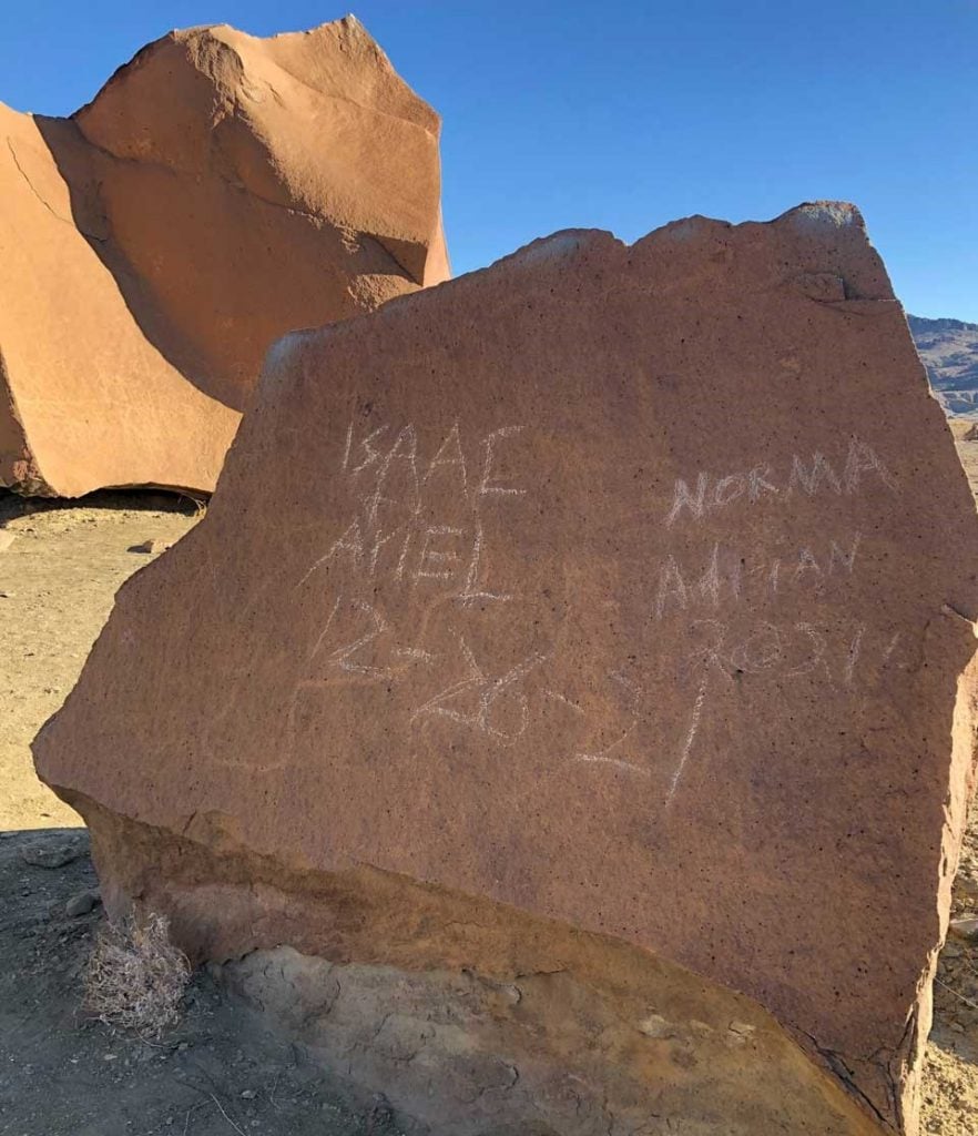 A panel of ancient petroglyphs at Big Bend National Park defaced by vandals. Courtesy of the National Park Service.