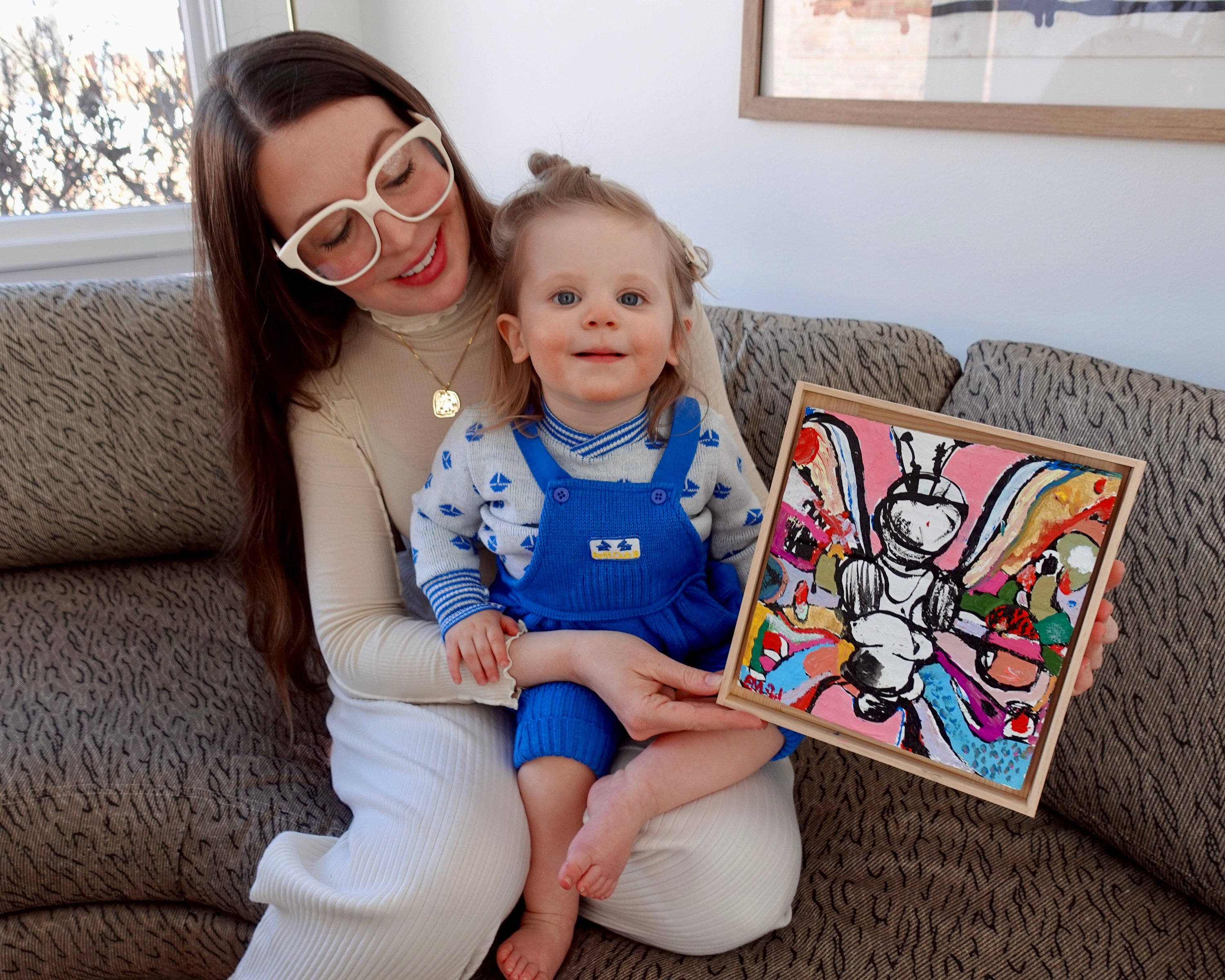 Bridget Finn with her daughter Florence Beaubien and an artwork by Eddie Martinez. Photo courtesy of Flourish.