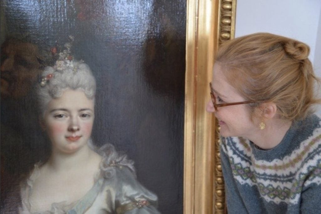 Pauline Baer de Perignon with Nicolas de Largillière's painting Portrait of a lady as Pomona, which was looted from her great grandfather during World War II. Photo by Julien Baer.